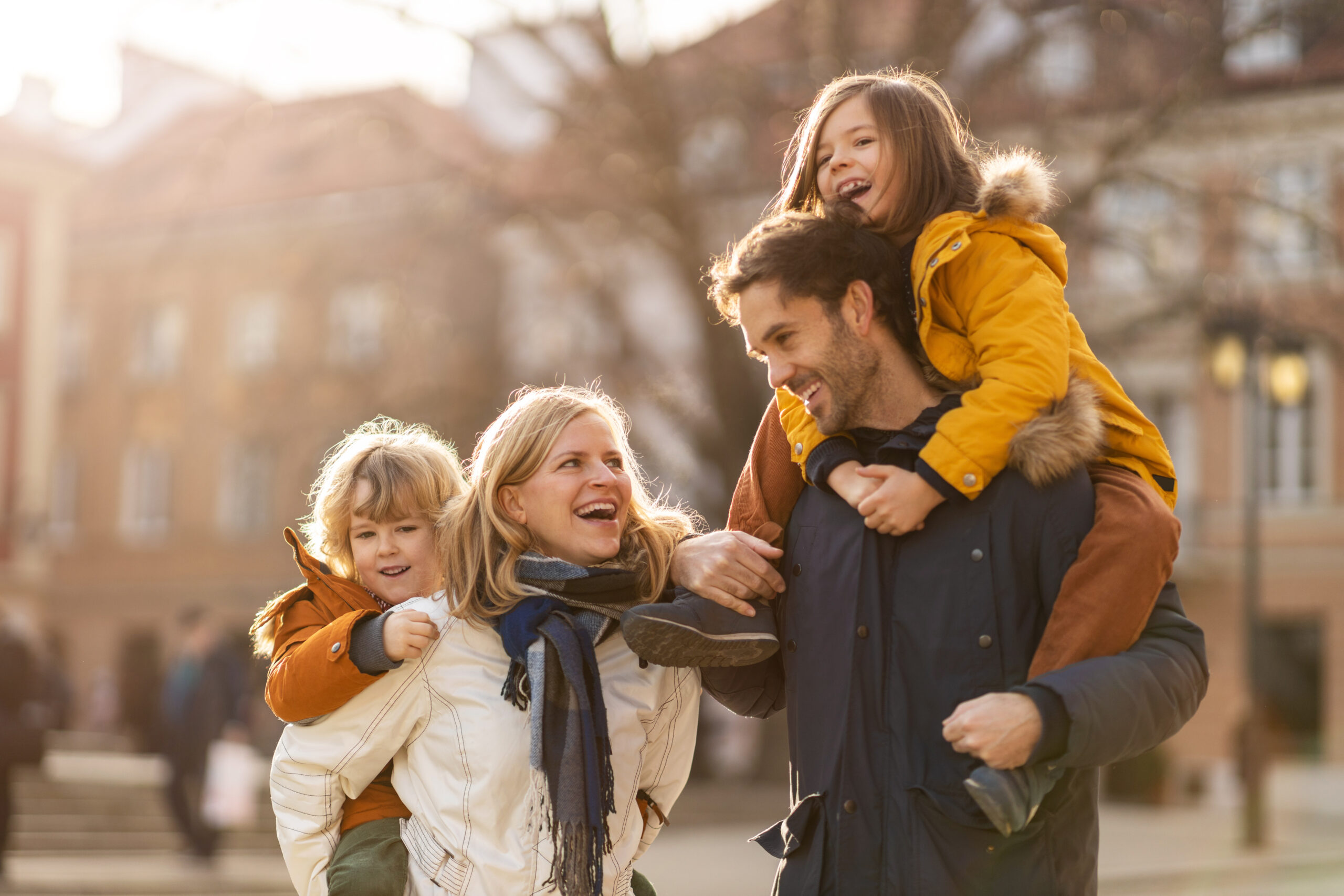 Affectionate young family enjoying their day in a city Affectionate young family enjoying their day in a city